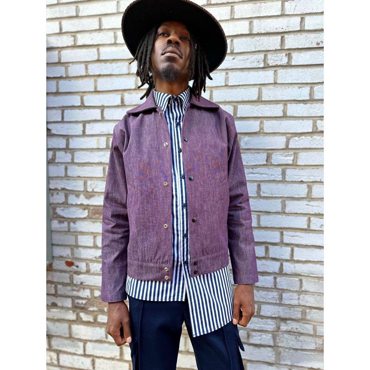NUBIAN（ヌビアン）の「【PURPLE STAIN】SPRAY LOGO DENIM